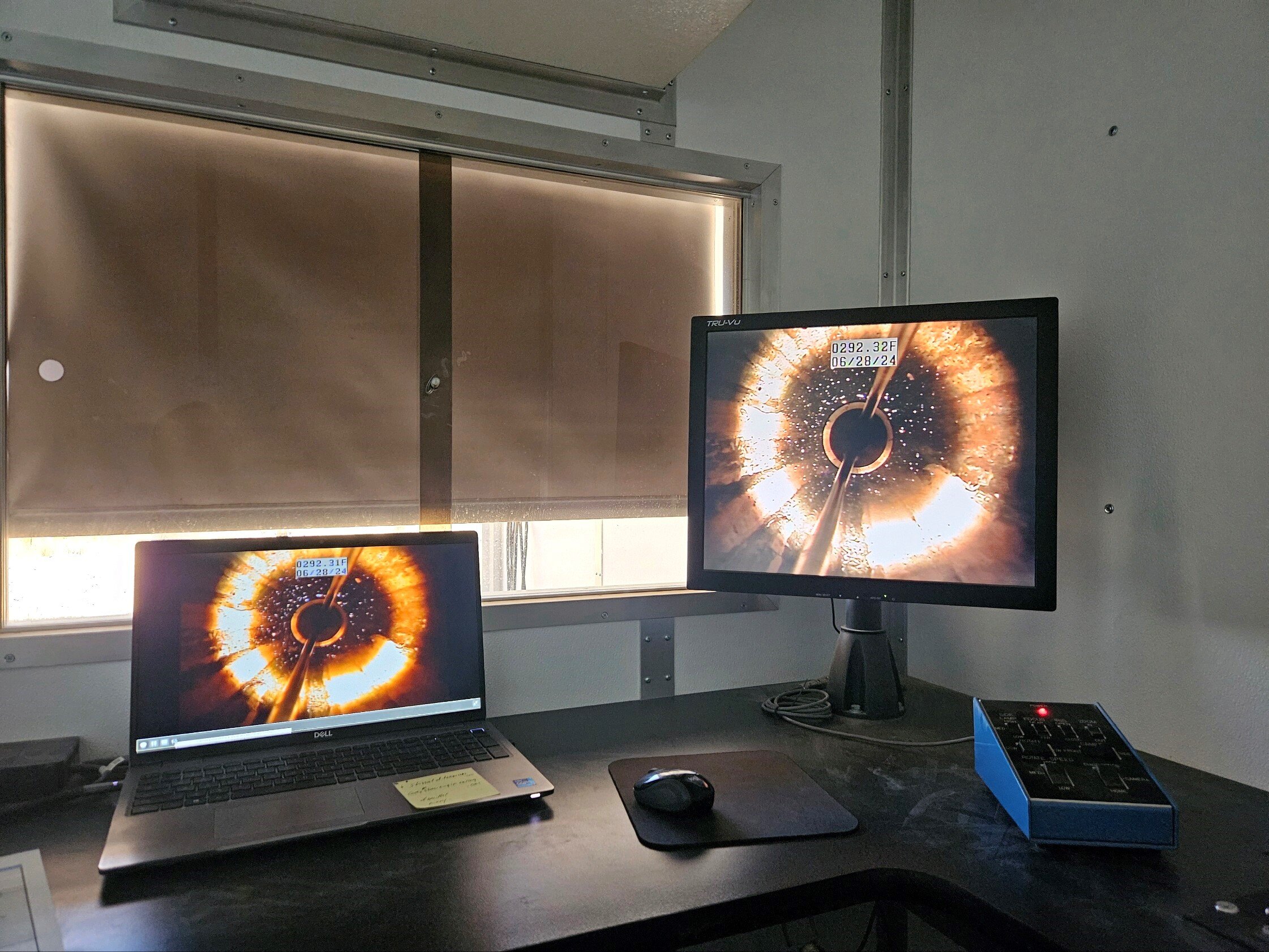 Two monitors showing the inside of a well